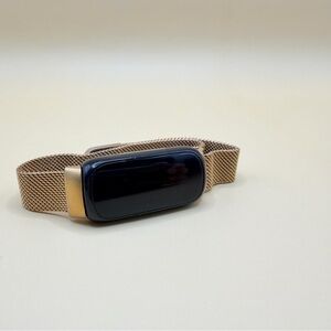 Smart Fitness Tracker with Black and Gold Accents